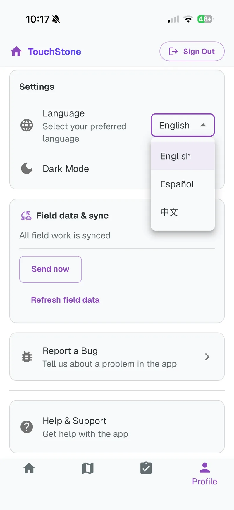 The canvasser app's settings with the language menu open on English, Español, and Chinese, above the field data sync card